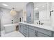Elegant bathroom featuring dual sinks, a soaking tub, and modern fixtures for a luxurious and spa-like experience at 2885 Laurel Green Ct, Roswell, GA 30076