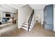 Open concept home with staircase and view of the living, dining, and kitchen spaces at 2885 Laurel Green Ct, Roswell, GA 30076