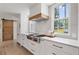 Stylish kitchen featuring stone countertops, stainless steel appliances, and wood accents at 2885 Laurel Green Ct, Roswell, GA 30076