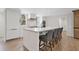 Well-appointed kitchen featuring a large island with bar stools, and modern appliances at 2885 Laurel Green Ct, Roswell, GA 30076