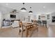 Open-concept living space with modern dining area, fireplace, and stylish kitchen design at 2885 Laurel Green Ct, Roswell, GA 30076