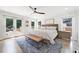 Spacious main bedroom with french door access to a backyard view, a king bed, and stylish modern decor at 2885 Laurel Green Ct, Roswell, GA 30076