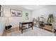 Well-lit office with a functional desk, storage, decor, and a large cow photograph perfect for work and creativity at 2885 Laurel Green Ct, Roswell, GA 30076