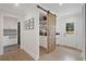 Spacious pantry with sliding barn door, custom shelving, and convenient counter space at 2885 Laurel Green Ct, Roswell, GA 30076