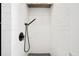 Modern shower stall with white subway tile and black fixtures, showcasing a sleek design at 2885 Laurel Green Ct, Roswell, GA 30076