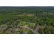 Expansive wooded lot with home, mature trees, and green landscaping at 3852 Drew Campground Rd, Cumming, GA 30040
