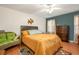 Spacious bedroom with neutral walls, ceiling fan, wood floors, and large windows at 3852 Drew Campground Rd, Cumming, GA 30040