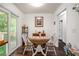 Cozy dining area with wood floors, slider access to deck, and seating for two at 3852 Drew Campground Rd, Cumming, GA 30040