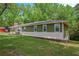 Attractive exterior of a one-story home featuring a lush green lawn at 3852 Drew Campground Rd, Cumming, GA 30040