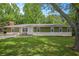 Charming home with a well-manicured front yard and an inviting stone facade at 3852 Drew Campground Rd, Cumming, GA 30040