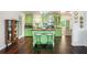 Charming eat-in kitchen with green cabinetry, a center island, and stainless appliances at 3852 Drew Campground Rd, Cumming, GA 30040