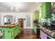 Stylish kitchen featuring stainless appliances, green cabinets, butcher block counters at 3852 Drew Campground Rd, Cumming, GA 30040