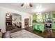 Open kitchen and living area featuring green cabinets and a brick fireplace at 3852 Drew Campground Rd, Cumming, GA 30040