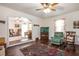 Spacious living area with hardwood floors, vintage furniture, and views into another sitting area at 3852 Drew Campground Rd, Cumming, GA 30040