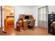 Functional office space adjacent to a bedroom, with a built-in desk and ample storage at 3852 Drew Campground Rd, Cumming, GA 30040
