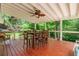 Inviting covered porch featuring a dining set, creating a serene outdoor dining experience at 3852 Drew Campground Rd, Cumming, GA 30040