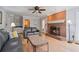 Cozy living room with a brick fireplace and hardwood floors at 4423 Windsor Oaks Cir, Marietta, GA 30066