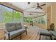 Screened porch with ceiling fan, grill, and plenty of seating, perfect for relaxing and entertaining outdoors at 4423 Windsor Oaks Cir, Marietta, GA 30066