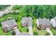 Aerial shot of the home showcasing the property's location and well-manicured lawn at 5770 Bridleton Xing, Suwanee, GA 30024