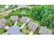 Overhead view highlighting the homes placement in a neighborhood near a pond and green space at 5770 Bridleton Xing, Suwanee, GA 30024