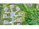 Aerial view of the property highlighting its location on a cul-de-sac near a pond and green space at 5770 Bridleton Xing, Suwanee, GA 30024
