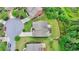 Aerial view of the backyard showcasing the deck and landscaped garden next to a wooded area at 5770 Bridleton Xing, Suwanee, GA 30024