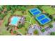 Beautiful aerial view of a community featuring tennis courts, a pool, and lush green spaces at 5770 Bridleton Xing, Suwanee, GA 30024
