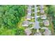 Aerial view of a two story home with a deck and walk-out basement located in a suburban neighborhood at 5770 Bridleton Xing, Suwanee, GA 30024