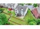 Aerial shot of the back of the house featuring a nice back yard, a deck, and a walkout basement at 5770 Bridleton Xing, Suwanee, GA 30024