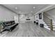Spacious basement with recessed lighting, cozy seating, and modern finishes at 5770 Bridleton Xing, Suwanee, GA 30024