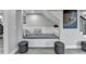 Basement reading nook with plush seating and a modern painting at 5770 Bridleton Xing, Suwanee, GA 30024