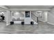 The spacious basement includes bonus room with a reading nook and stairs to the upper level at 5770 Bridleton Xing, Suwanee, GA 30024