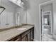Bathroom featuring a single sink vanity with granite countertop and tile flooring at 5770 Bridleton Xing, Suwanee, GA 30024