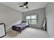 Cozy bedroom with carpet, ceiling fan and natural light from the windows at 5770 Bridleton Xing, Suwanee, GA 30024