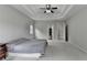 Spacious bedroom with a trey ceiling, neutral paint, large windows and plush carpet at 5770 Bridleton Xing, Suwanee, GA 30024