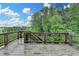 Wooden deck with dark railings, showcasing the outdoor living space and natural light at 5770 Bridleton Xing, Suwanee, GA 30024
