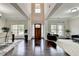 Bright foyer features hardwood floors, soaring ceilings, and a beautiful front door with sidelights at 5770 Bridleton Xing, Suwanee, GA 30024