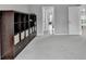 Hallway view with large storage shelves and multiple doors leading to different rooms at 5770 Bridleton Xing, Suwanee, GA 30024