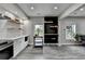 The kitchen boasts a breakfast bar, stainless appliances, lots of light, and modern finishes at 5770 Bridleton Xing, Suwanee, GA 30024