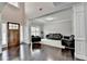 Elegant living room features hardwood floors, with views to the front door and plush seating at 5770 Bridleton Xing, Suwanee, GA 30024