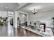 Spacious living room with hardwood floors, fireplace, and dining room area for entertaining at 5770 Bridleton Xing, Suwanee, GA 30024