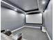 Home theater with a large screen, custom lighting, and dark gray walls at 5770 Bridleton Xing, Suwanee, GA 30024