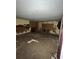 A dirty bedroom with damaged walls and debris on the floor at 711 Alfred Nw Rd, Atlanta, GA 30331