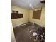 A dirty bedroom with damaged walls and debris on the floor at 711 Alfred Nw Rd, Atlanta, GA 30331