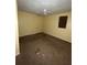 A dirty bedroom with stained walls and a stained carpet at 711 Alfred Nw Rd, Atlanta, GA 30331