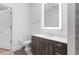 Bathroom with sleek vanity, illuminated mirror, and tiled shower with a glass door at 775 Juniper Ne St # 210, Atlanta, GA 30308