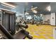 Modern gym features state-of-the-art equipment, mirrored wall, and bright lighting at 775 Juniper Ne St # 210, Atlanta, GA 30308