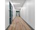 Long hallway with neutral toned flooring and modern lighting at 775 Juniper Ne St # 210, Atlanta, GA 30308