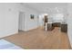 Open concept living room with hardwood floors that flows into the kitchen at 775 Juniper Ne St # 210, Atlanta, GA 30308