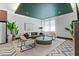 Comfortable lounge space with plush seating, decorative plants, and natural light at 775 Juniper Ne St # 210, Atlanta, GA 30308